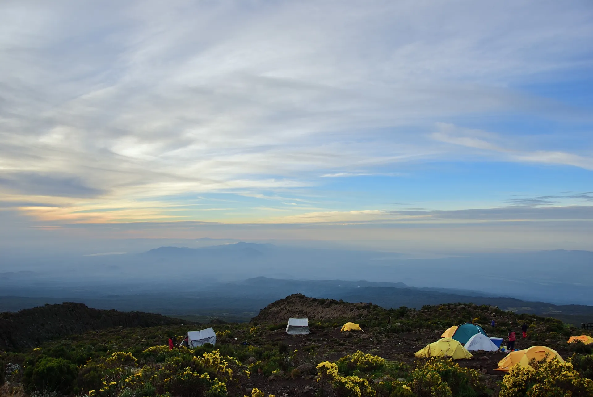 Northern Circuit — Kilimanjaro camp at dusk, tents glowing orange